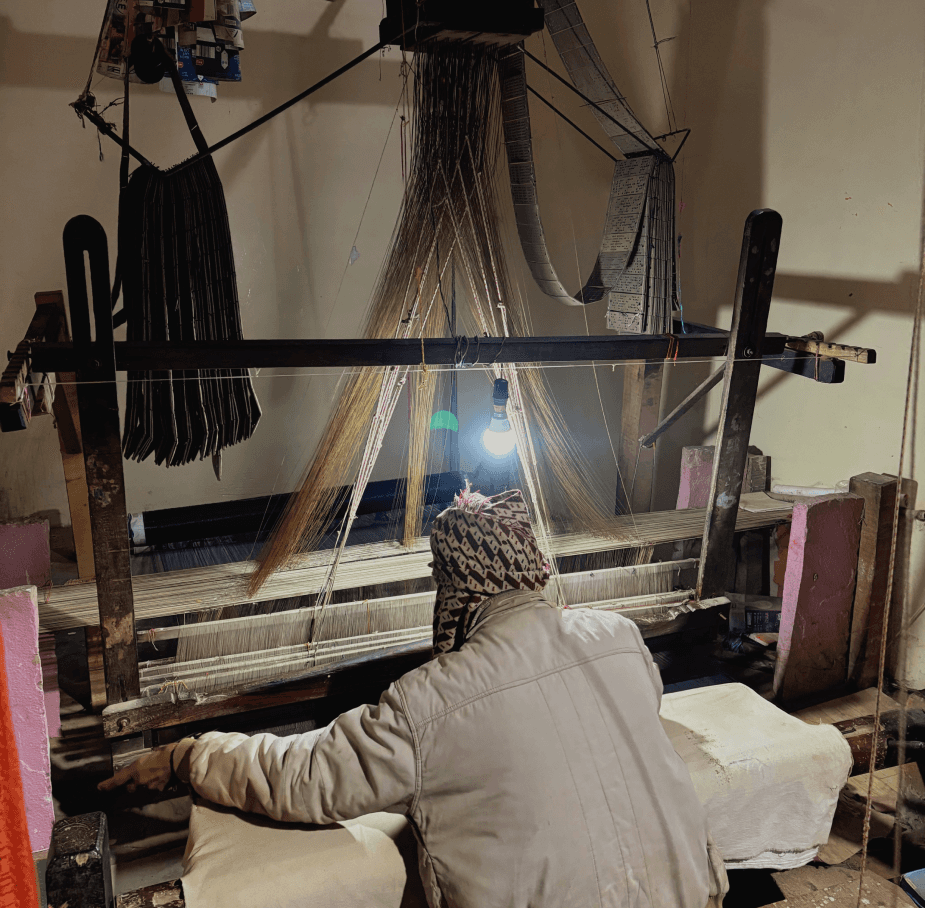 Artisan working at a handloom